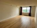 Spacious bedroom with hardwood floors and a large window at 2479 Peachtree Rd # 601, Atlanta, GA 30305