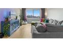 Cozy living room with hardwood floors and a view of the city skyline at 2479 Peachtree Rd # 601, Atlanta, GA 30305