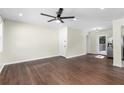 Bright living room with gleaming hardwood floors, ceiling fan and lots of natural light at 1661 Barrett Nw Dr, Atlanta, GA 30318