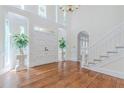 Grand foyer with hardwood floors, high ceilings, and a staircase, creating an inviting entrance at 5460 Lichenhearth Ct, Stone Mountain, GA 30087
