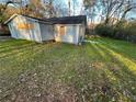 Lawn surrounds home with patchy grass and fallen leaves at 274 Fairburn Nw Rd, Atlanta, GA 30331