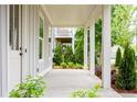 Inviting covered porch with view to adjacent garden at 2761 Mathews St, Smyrna, GA 30080