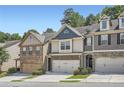 Attractive townhouse with stone veneer, attached garage, and manicured landscaping in a desirable neighborhood at 2212 Knoxhill Se Vw, Smyrna, GA 30082