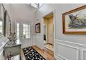 Beautiful foyer with hardwood floors, transom windows, and decorative artwork offers a warm welcome at 4485 Cadmium Dr, Cumming, GA 30040