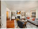 Bright living room boasts hardwood floors, fireplace, and modern decor for comfortable living at 1928 Main Nw St, Atlanta, GA 30318