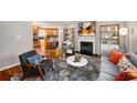 Open concept living area with hardwood floors, fireplace, and seamless flow to the kitchen at 1928 Main Nw St, Atlanta, GA 30318