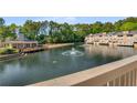 Picturesque community lake with water fountain and resident club house at 27 Lakes Edge Se Dr, Smyrna, GA 30080