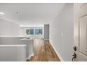 Inviting home hallway with wood flooring with view of the spacious living room at 27 Lakes Edge Se Dr, Smyrna, GA 30080