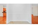 Bright hallway featuring hardwood floors, molding and access to the kitchen and other living areas at 557 Lawton Sw St, Atlanta, GA 30310