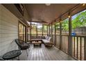 Relaxing screened-in porch with comfortable seating, perfect for enjoying the outdoors at 4934 Woodstream Nw Ln, Acworth, GA 30102