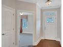 Inviting foyer featuring hardwood floors and a white front door with glass panel at 3538 Serenade Nw Commons, Kennesaw, GA 30152