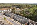 Community aerial view with trees and other homes nearby at 3016 Creekside Overlook Way, Austell, GA 30168