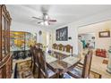 Traditional dining room featuring a large dining table with seating for eight and decorative screen at 1031 Bettina Sw Ct, Mableton, GA 30126