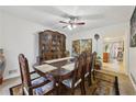 Traditional dining room featuring a large dining table with seating for eight and china cabinet at 1031 Bettina Sw Ct, Mableton, GA 30126