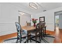 Elegant dining room featuring wainscoting, a stylish chandelier, and ample natural light at 2265 Venture Dr, Marietta, GA 30062