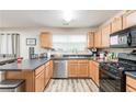 Well-lit kitchen with stainless steel appliances, lots of counter space, and modern finishes at 314 Meadows Ln, Canton, GA 30114