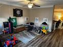 ' playroom features hardwood floors, ceiling fan, and fun decorations at 314 Meadows Ln, Canton, GA 30114
