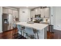 Well-equipped kitchen featuring stainless steel appliances, a center island with bar seating, and a pantry at 4724 Electric Sw Ave, Mableton, GA 30126