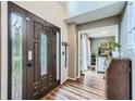Inviting entryway featuring a decorative glass front door, hardwood floors, and views into the front room at 5170 Ridge Tarn, Acworth, GA 30102