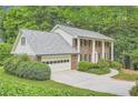 Brick home with a manicured lawn and mature trees at 2034 Starfire Ne Dr, Atlanta, GA 30345