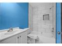 Stylish bathroom featuring a tiled shower and tub combination at 4064 Post Rd, Winston, GA 30187
