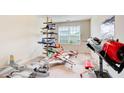 Unique bedroom showcasing an aviation theme with model airplanes, a large window, and neutral walls at 10892 Big Sky Dr, Hampton, GA 30228