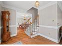 Inviting foyer with hardwood floors, staircase, and traditional details creating a warm and elegant entrance at 3331 Lockwood Sw Ct, Lilburn, GA 30047