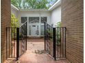 A decorative black metal gate leads to the front door at 4701 Riverwood Cir, Decatur, GA 30035
