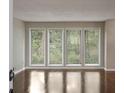 Bright living room features gleaming hardwood floors and large windows at 4701 Riverwood Cir, Decatur, GA 30035