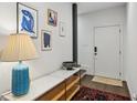 Bright entryway featuring modern art, stylish console table, and dark wood flooring at 584 Bismark Ne Rd, Atlanta, GA 30324