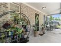 Charming front porch decor with a variety of plants and comfortable rocking chairs at 165 6Th St, Auburn, GA 30011