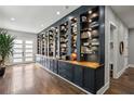 Elegant hallway with extensive built-in shelving and polished hardwood flooring at 2020 Bixby Se St, Atlanta, GA 30317