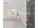 Bright living room with open view to kitchen and light tile floors creating an inviting space at 2331 Suwanee Pointe Dr, Lawrenceville, GA 30043