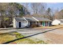 View of home with spacious front yard and a driveway at 447 Wallace Way, Rockmart, GA 30153