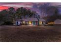 Front exterior view of a single story home with a moody and colorful sky at 447 Wallace Way, Rockmart, GA 30153