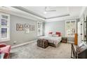 Serene bedroom with tray ceilings, plantation shutters, and a comfortable queen-sized bed at 1055 Chelsey Way, Roswell, GA 30075