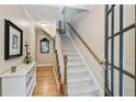 Welcoming foyer with hardwood floors, staircase, and tasteful decor at 11187 Calypso Dr # 12, Alpharetta, GA 30009