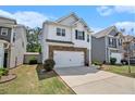 Inviting two-story home with a well-kept lawn and an attached two-car garage at 118 Woodhouse Cir, Acworth, GA 30102