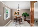 Charming breakfast nook with a round table, bar stools, and a view of the outdoors at 331 Lakemoore Ne Dr # C, Atlanta, GA 30342
