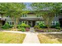 Charming townhome with lush landscaping, inviting walkway and manicured front yard at 331 Lakemoore Ne Dr # C, Atlanta, GA 30342