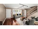 Stylish living room featuring hardwood floors, neutral paint, and ample natural light at 331 Lakemoore Ne Dr # C, Atlanta, GA 30342