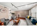 Spacious living room showcasing comfortable seating, a decorative rug, and a built-in shelving unit at 331 Lakemoore Ne Dr # C, Atlanta, GA 30342
