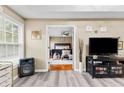 Comfortable living space offering an open doorway to main bedroom and neutral walls at 100 Lantana Dr, Locust Grove, GA 30248
