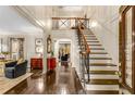 Elegant foyer boasts hardwood floors, a staircase, and high ceilings with classic trim work at 1285 Wesley Nw Pl, Atlanta, GA 30327