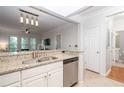 Modern kitchen overlooking a dining area, equipped with stainless steel appliances at 1850 Cotillion Dr # 4306, Dunwoody, GA 30338
