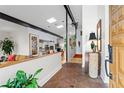 Open-concept foyer with stone floors, skylights, and views into the living room and kitchen at 5148 Stratham Dr, Dunwoody, GA 30338