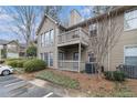 A condo with a two-story facade and a small balcony showcasing the exterior features at 2002 Country Park Se Dr, Smyrna, GA 30080