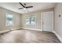 Bright living room featuring hardwood floors, fresh neutral paint and entry door at 1002 Ira Sw St, Atlanta, GA 30310