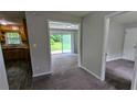 View of the interior featuring neutral-toned walls, carpeted flooring, and doors to other rooms at 1091 Luther Sw Dr, Mableton, GA 30126