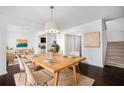 Open dining room with modern decor, adjacent to the living room, and views of the kitchen at 1468 Briarwood Ne Rd # 2003, Atlanta, GA 30319